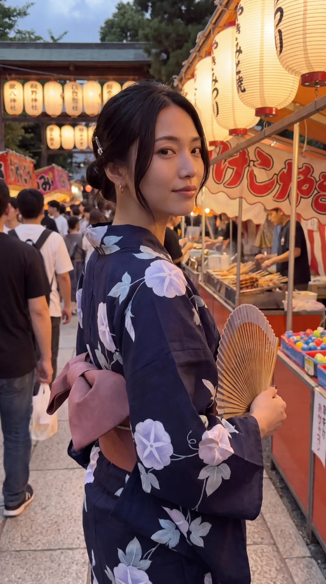 Nao in a navy yukata at a summer festival